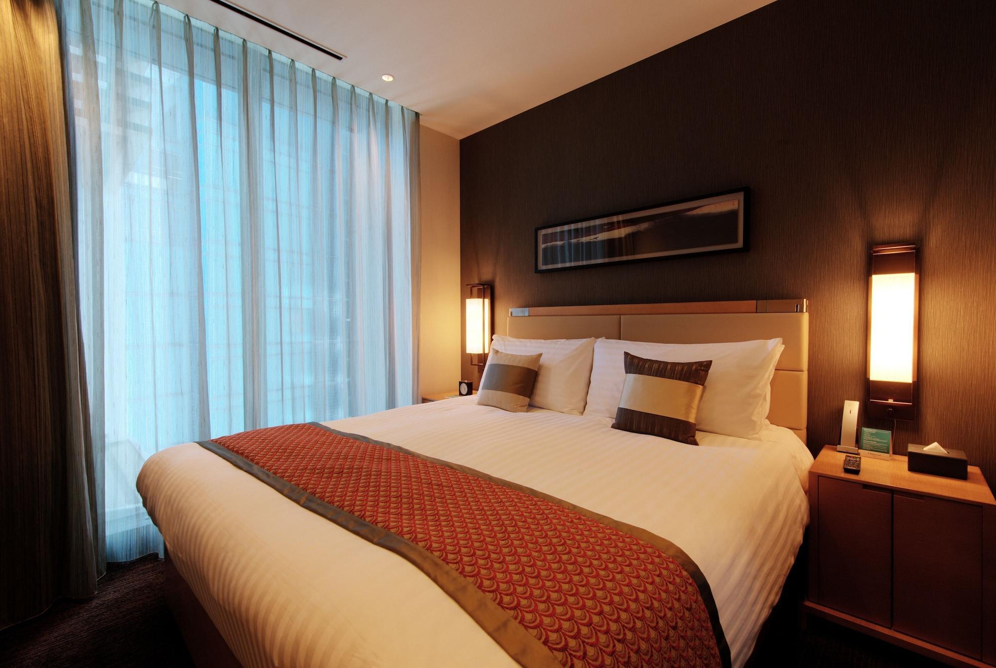 Oakwood Premier Tokyo Hotel Exterior photo A bedroom in a hotel