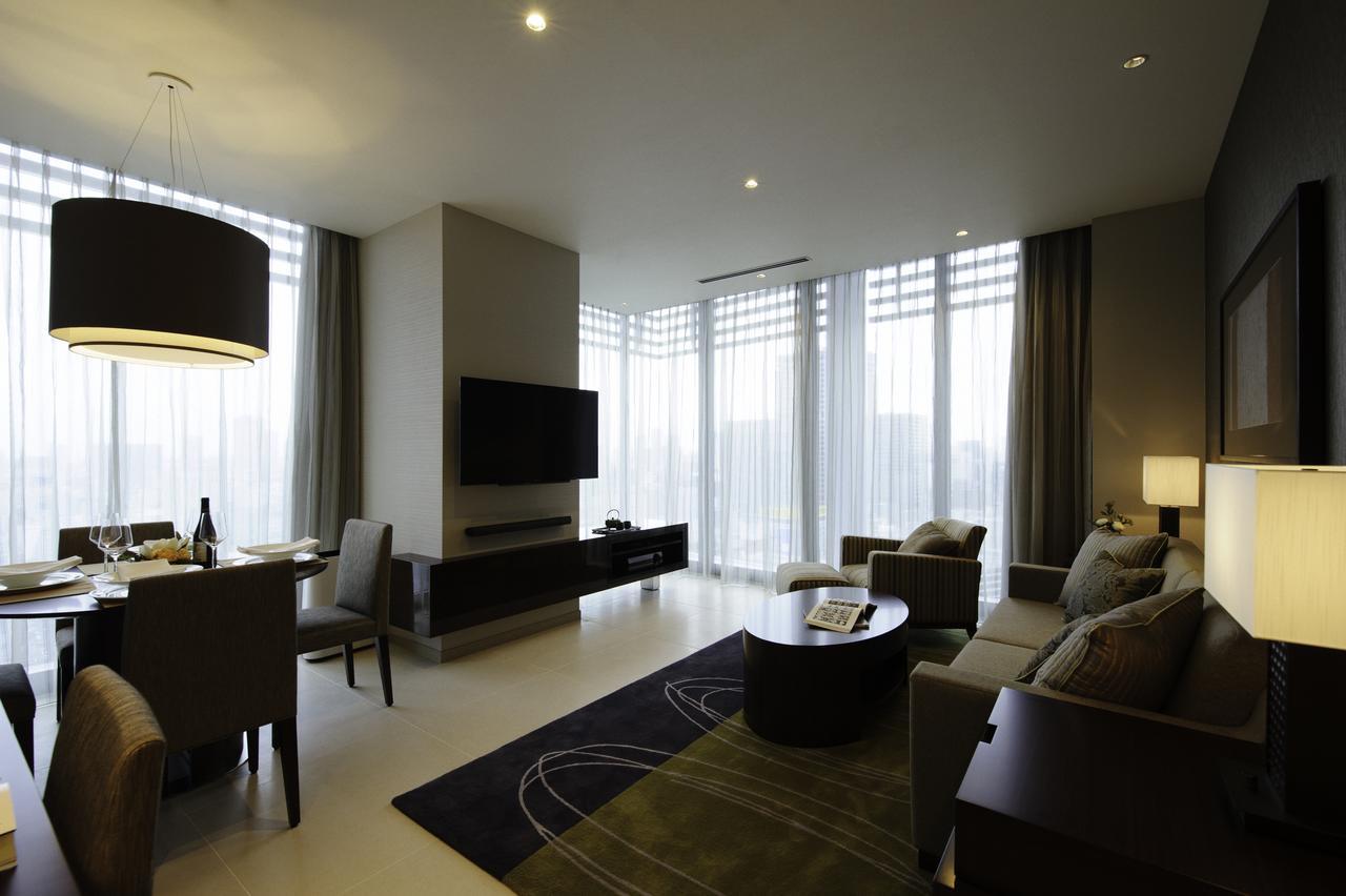 Oakwood Premier Tokyo Hotel Exterior photo A living room in a suite at the hotel